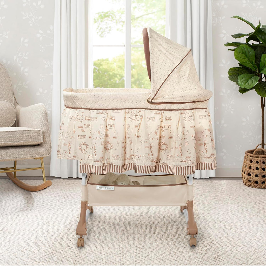Delta Children Portable Rocking Bassinet for Newborns Bedside Sleeper Crib with Gentle Vibrations, Nightlight, Soothing Music, Adjustable Canopy, Plush Toys, Storage Basket, Baby Essentials